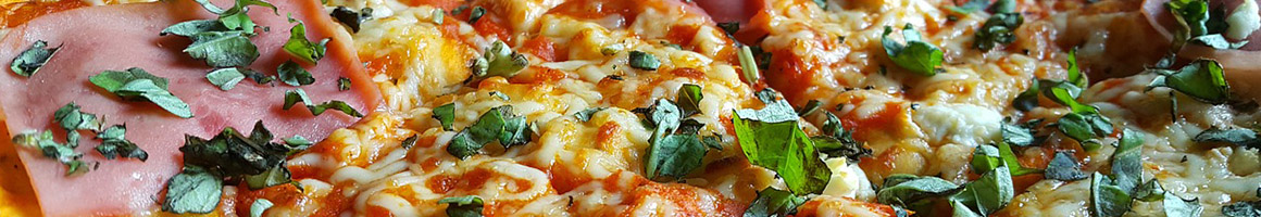 Eating Italian Pizza at Basilico Pizza, Pasta & Gourmet restaurant in Mt Kisco, NY.